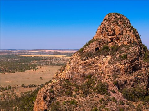 Drone aerial view of rugged mountain ranges in Outback Queensland, Australia - remote wilderness.