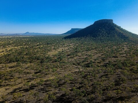Drone aerial view of rugged mountain ranges in Outback Queensland, Australia - remote wilderness.