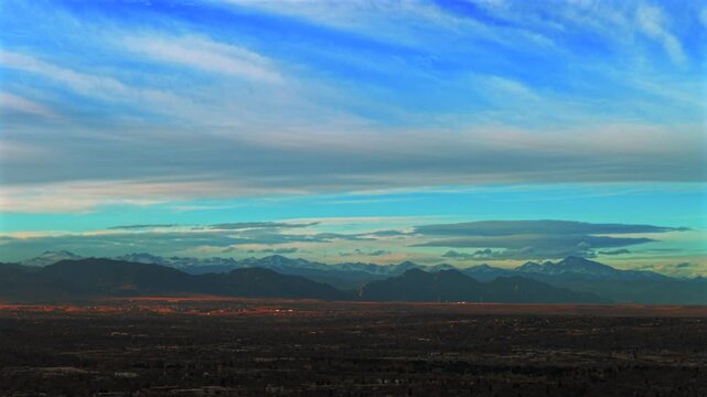 Front Range Rocky Mountains Denver winter landscape aerial drone landscape Boulder Flatirons Mountains sunset afternoon Wheatridge Arvada Broomfield Golden neighborhood suburbs forward pan up motion