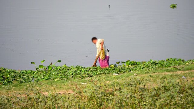 Shot of a fisherman catching fish with a fishing net at Deepor Beel Guwahati Assam Close-Up 2