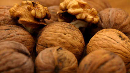 Close up of whole and shelled walnuts