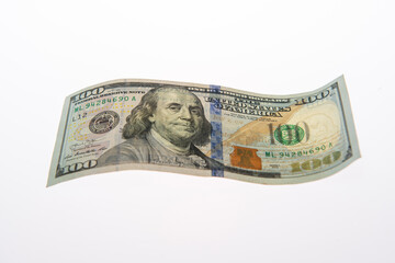 Money in 100 dollar bills on paper. Money in 100 USD dollar banknotes. Money in hundred dollar on white isolated background. Money in USA dollar banknote.