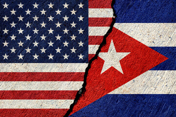 usa and cuba flags painted on concrete wall