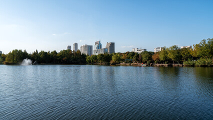 Obraz premium Urban Lake with Skyscrapers and Clear Blue Sky