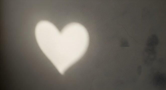 Abstract heart shape illuminated on a textured surface artistic background