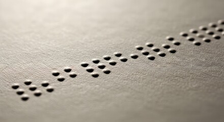 Close up of braille text on a textured surface for accessibility concepts