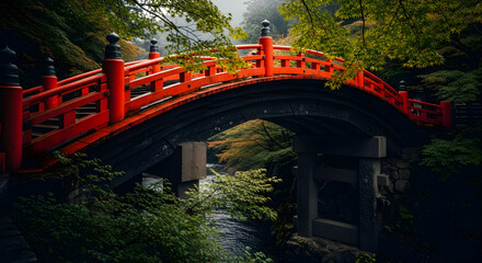 Close-up of Traditional Red Japanese Bridge with Lush Green Foliage Background