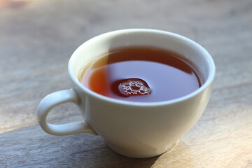 Hot coffee on a wooden table.