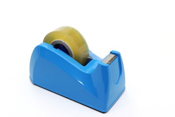 Blue tape dispenser with transparent adhesive tape, white background