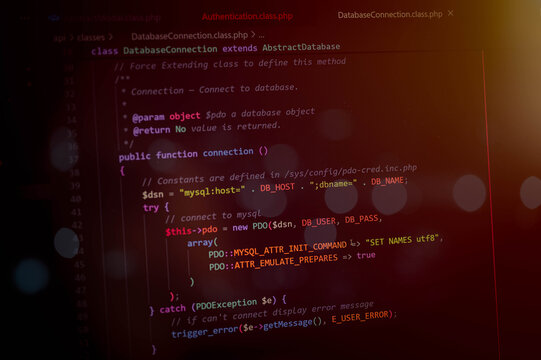 Abstract programming code on computer screen showing database connection and backend development concept. Software engineering, cybersecurity, coding, web application and technology.