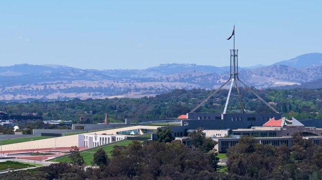 Wide Pan of Parliament House and Flagpole in Canberra Australia