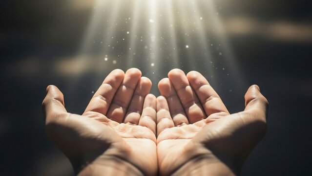 Two hands open facing upwards with rays of light shining down
