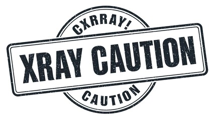 High-resolution warning stamp design with the words XRAY CAUTION styled differently.