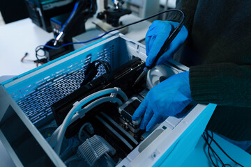 Hands repairing electronic devices. Electronic technician.