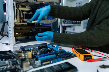 Hands repairing electronic devices. Electronic technician.