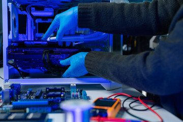 Hands repairing electronic devices. Electronic technician.