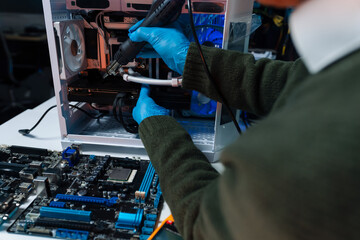 Hands repairing electronic devices. Electronic technician.