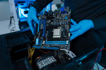 Hands repairing electronic devices. Electronic technician.