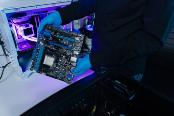 Hands repairing electronic devices. Electronic technician.