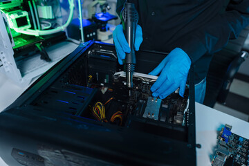 Hands repairing electronic devices. Electronic technician.