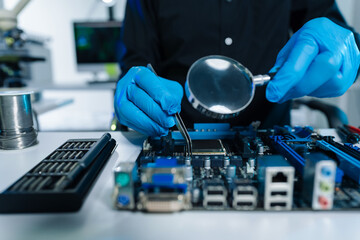 Hands repairing electronic devices. Electronic technician.
