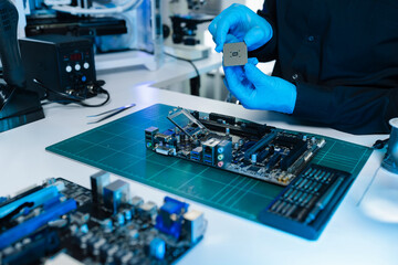 Hands repairing electronic devices. Electronic technician.