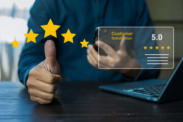 Happy Asian male businessman giving a thumbs up gesture of approval and success.