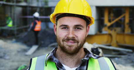 Fototapeta premium Happy, man and portrait of construction worker on site for building, maintenance or repairs on infrastructure. Smile, hardhat and male civil manager with confidence for project development in London.
