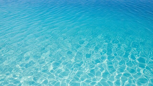 Clear turquoise water shimmers reflecting light in a weblike pattern