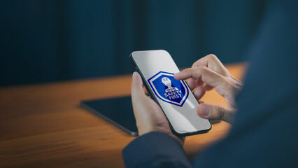 Safety first concept on smartphone for workplace industrial health and protection management. Business technology for construction security and occupational safety app.