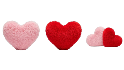 Three fluffy heart shaped pillows, two pink and one red, displayed against a white backdrop.