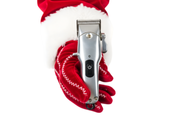 Closeup Santa hand with glove holding hair clipper on transparent background