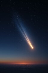 Bright meteor streaking through night sky at sunrise