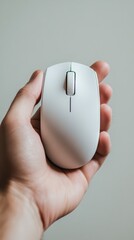 Human hand precisely controlling ergonomic computer mouse on desk enhancing digital workflow efficiency in modern office environment.