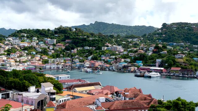 Motion timelapse over inner harbor of tropical Caribbean St. George's in Grenada