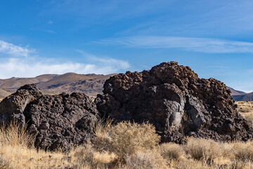 Obraz premium Trail to Little Lake Overlook, Coso Volcanic Field, Inyo County, California. Coso Range, Basin and Range Province. Volcanic rock, Basalt flows.