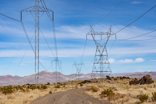 Trail to Little Lake Overlook, Coso Volcanic Field, Inyo County, California. Coso Range, Basin and Range Province. Volcanic rock, Basalt flows. Overhead power line

