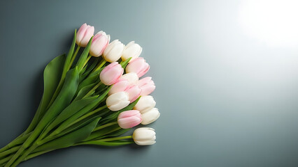 Beautiful bouquet of pink and white tulips on gray background