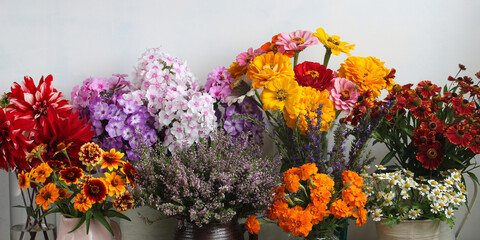 Colorful various garden flowers arranged as summer harvest bouquets