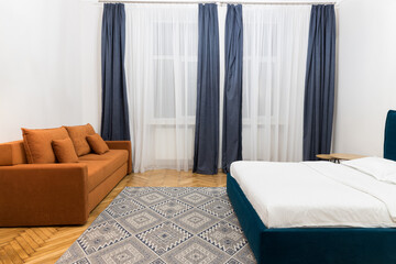 indoor bed room apartment pastel interior neutral design of motel inside space with sofa carpet and curtain