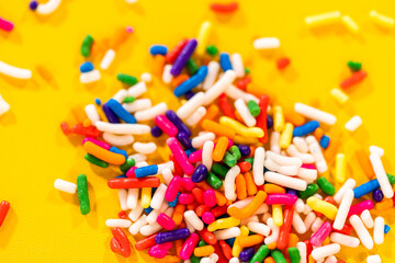 Colorful Sprinkles on Bright Yellow Background