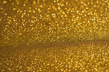 abstract background composed entirely of fine golden-yellow glitter particles