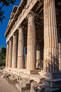 Massive Doric columns of the Temple of Hephaestus, one of the best-preserved ancient Greek temples, located in the Ancient Agora of Athens.