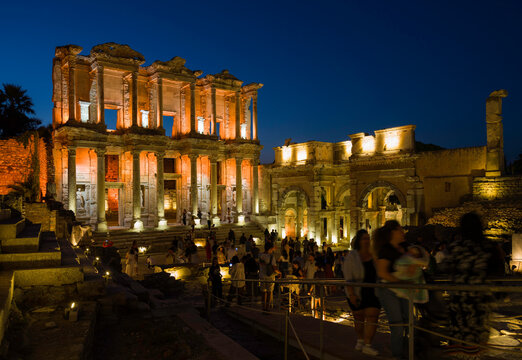 Izmir, T&uuml;rkiye. Ephesus Ancient City. Evening view of the Celsus Library. Tourists visiting the museum at night.
