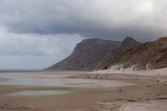 Man playing soccer on a beach alone in Socotra