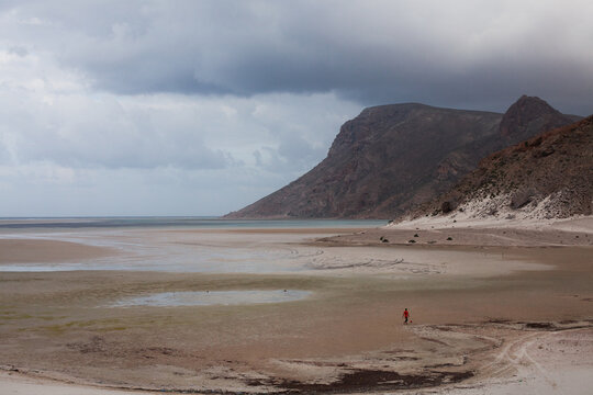 Man playing soccer on a beach alone in Socotra