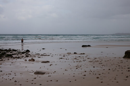 Man walking to the sea on Arher Beach in Socotra