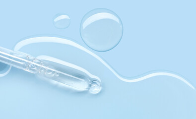 pipette drop of serum test on a blue background