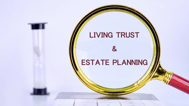 Words morph and then clarify as a magnifying glass reveals LIVING TRUST and ESTATE PLANNING. An hourglass stands beside, implying the importance of time in thoughtful planning