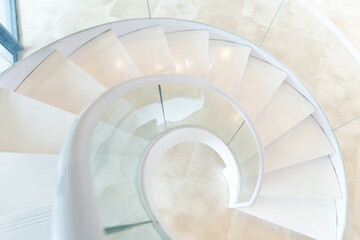 Beautiful white spiral staircase in the building